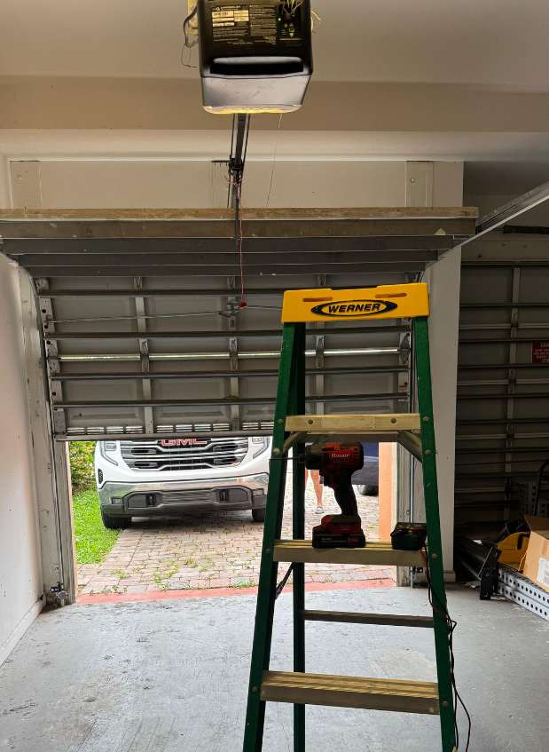 Professional technician performing automatic garage door services in San Diego, CA by Royal Plam Garage Door Repair SD
