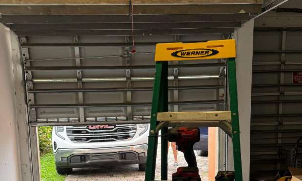 Garage door repair in San Diego — technician fixing broken spring